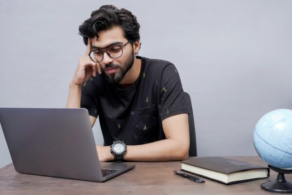 Laptop screen showing coding and technology work