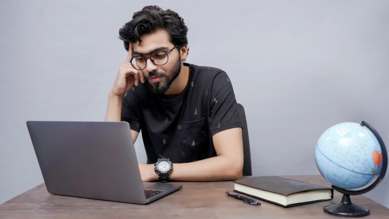 Laptop screen showing coding and technology work